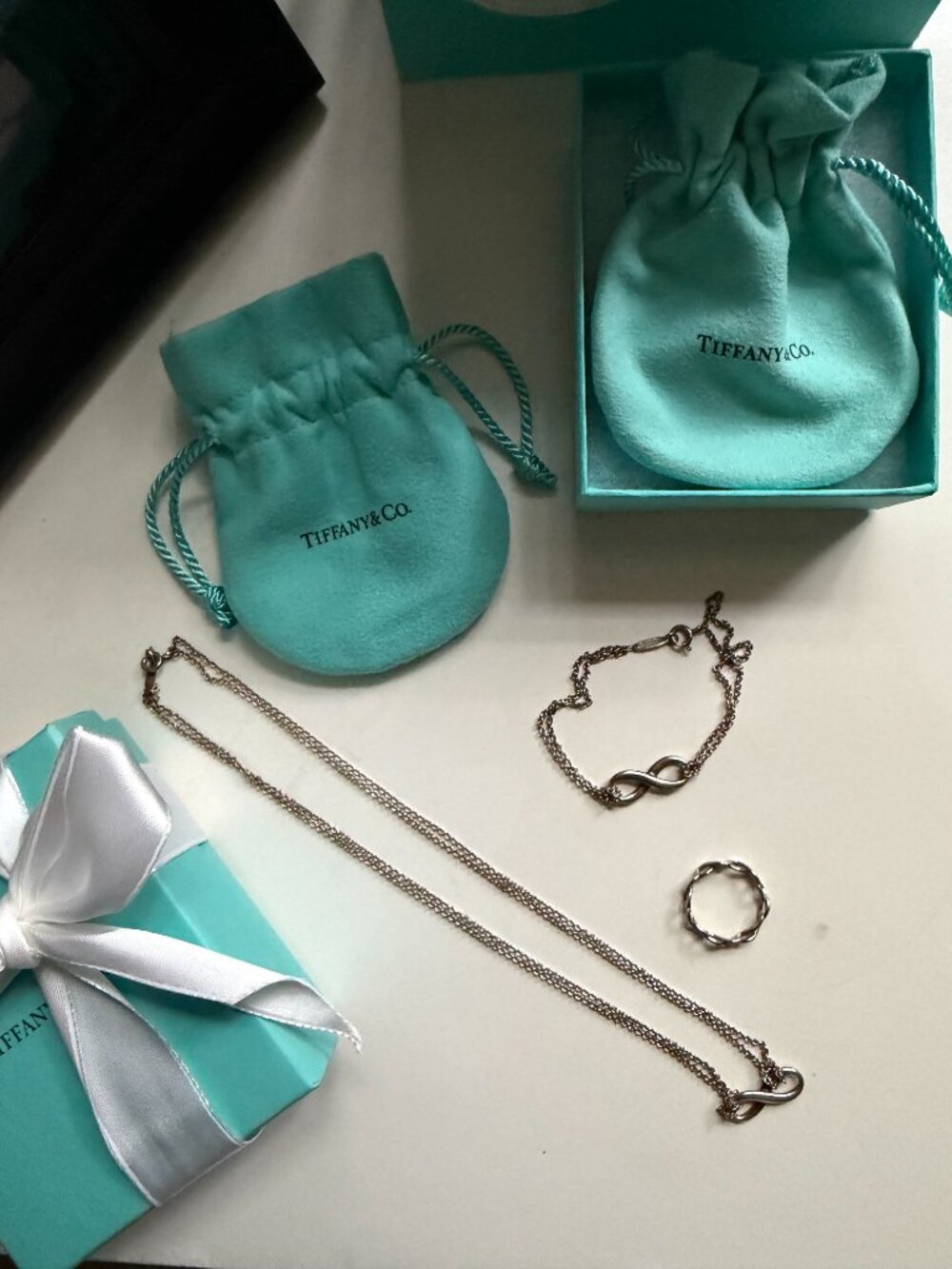 tiffany & co. sterling silver infinity necklace, bracelet, and ring set